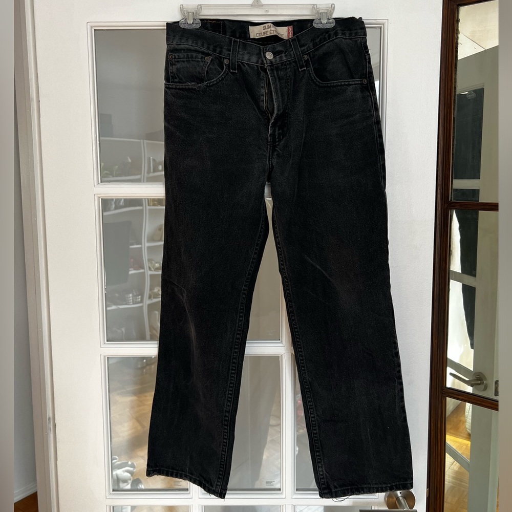 Vintage Levi's Black Slim boot leg fit. Washed denim
